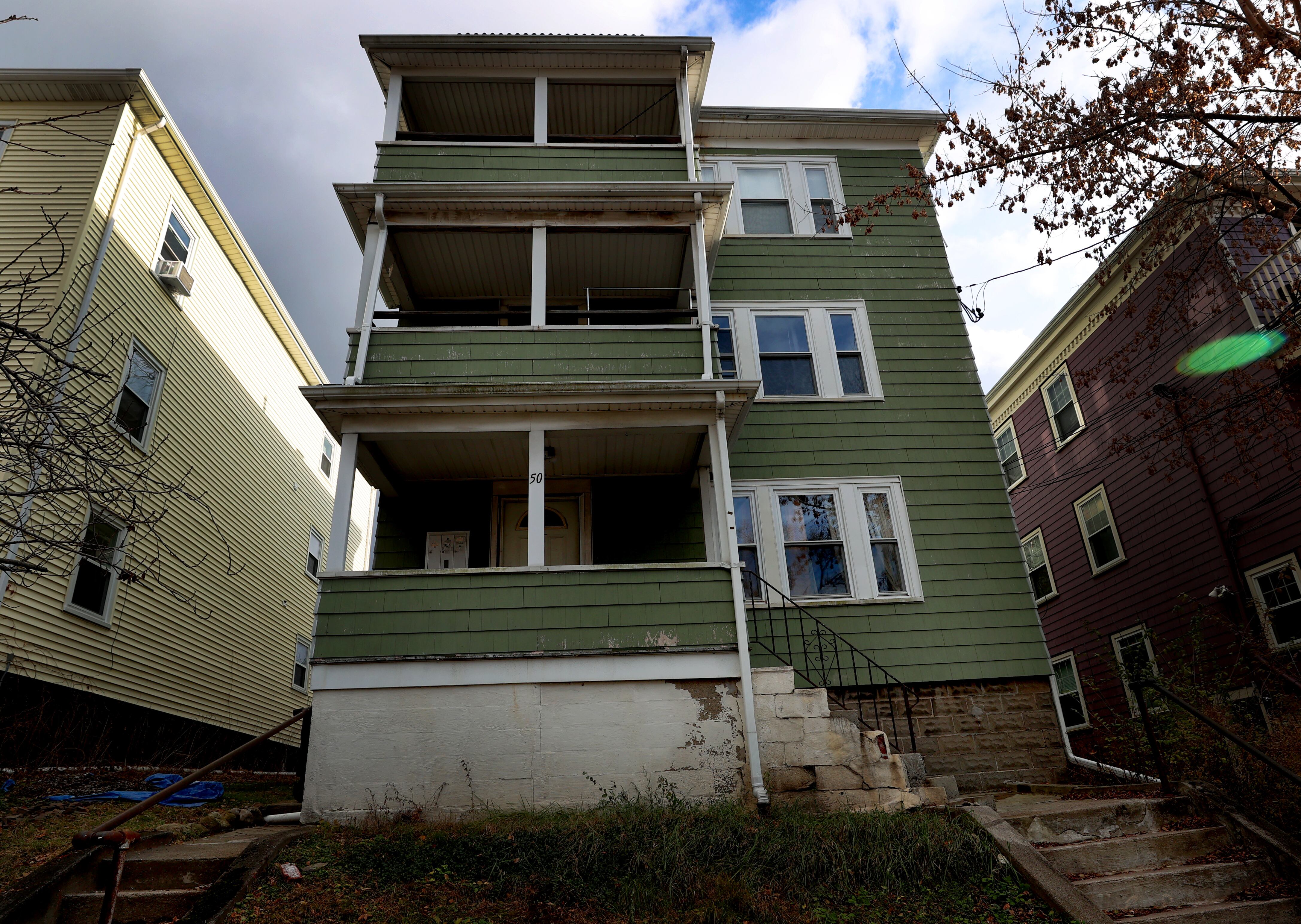 A view of a triple-decker on Clarendon Avenue in Somerville.